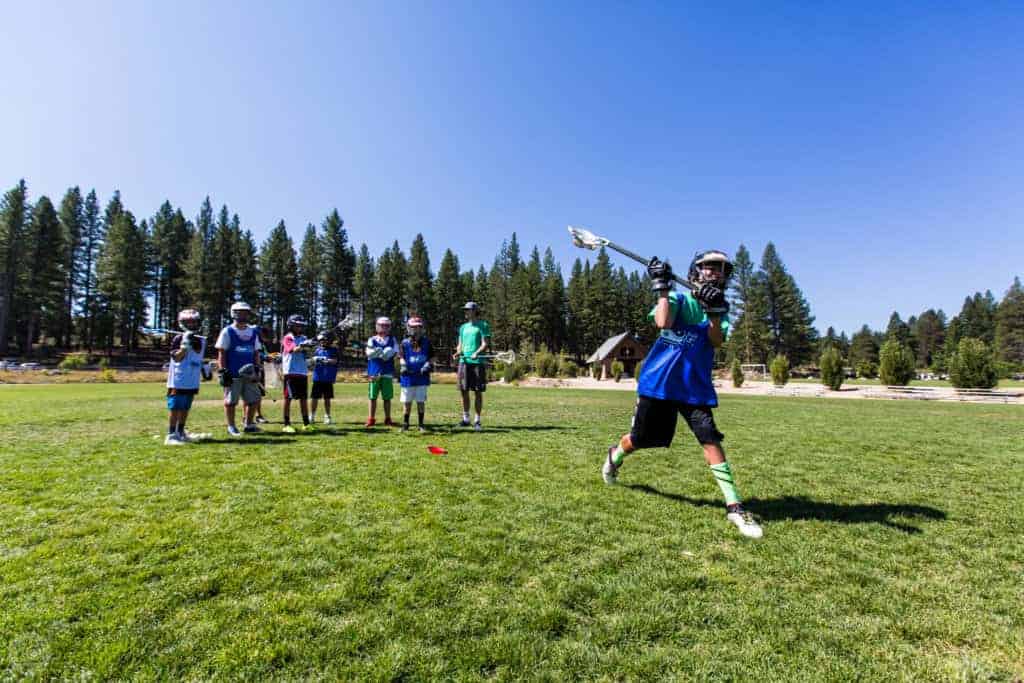 lacrosse team members practicing