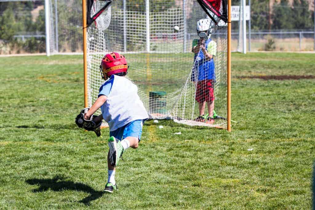 boys lacrosse member during shot practice