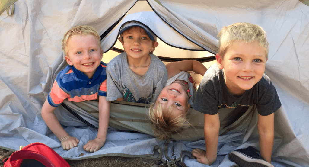 elementary students in a tent