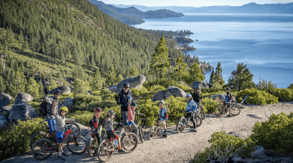 mountain biking camp members standing with their bikes