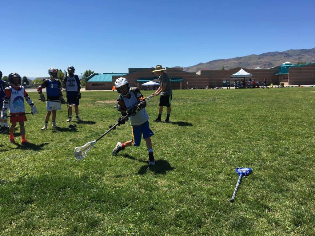 lacrosse camp team practicing on the field