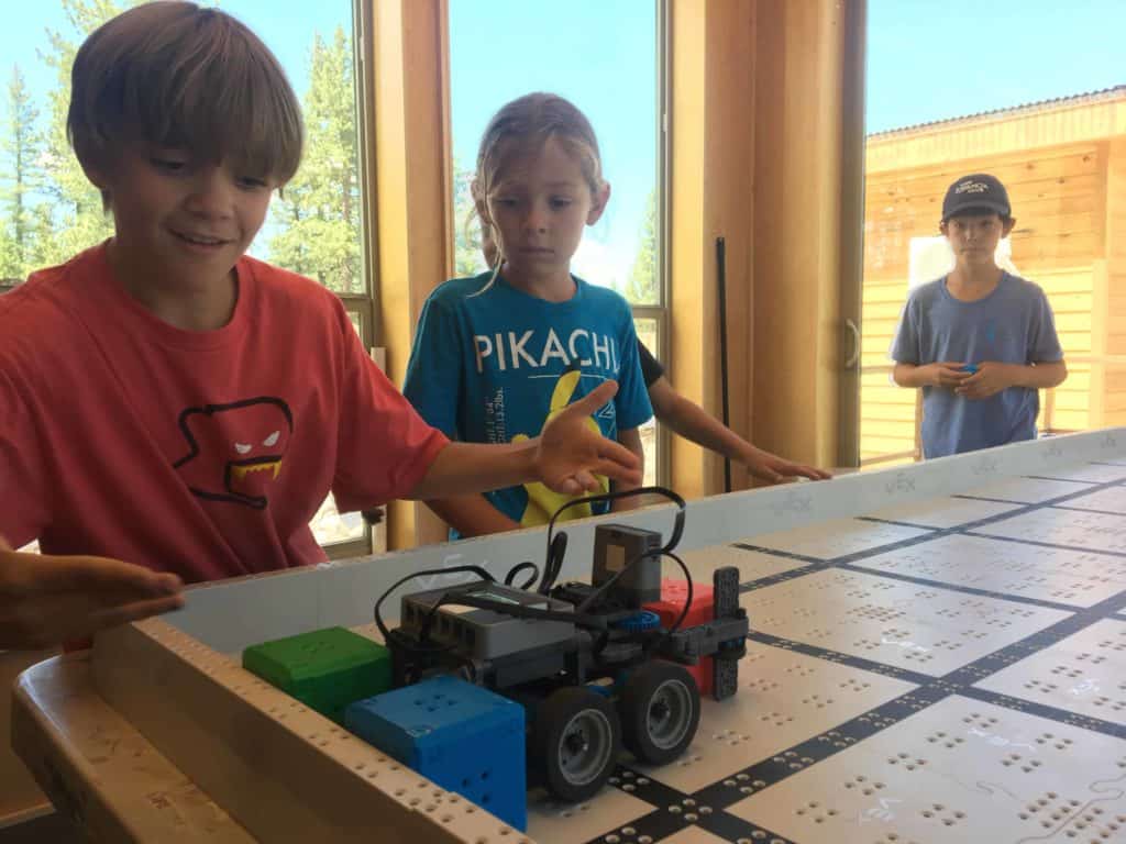 kid showing off his robot
