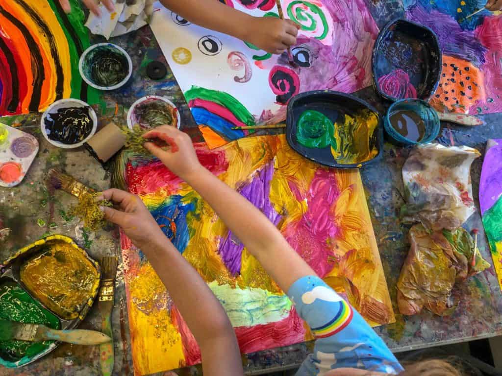 kids painting on a table