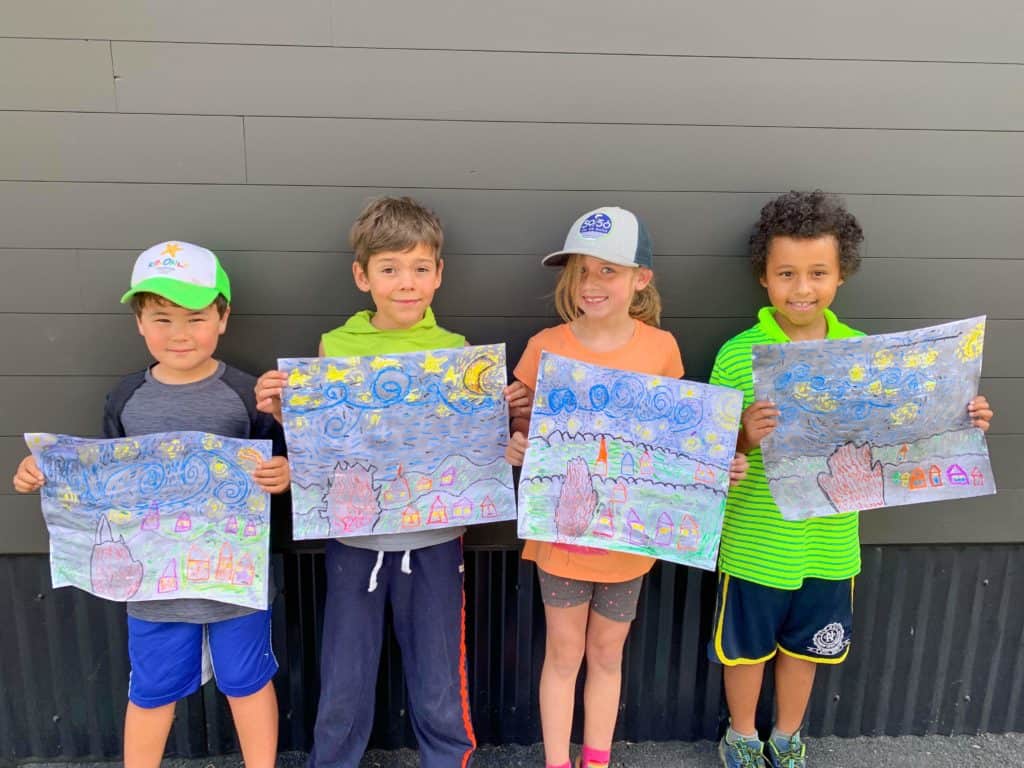 art campers holding their drawings