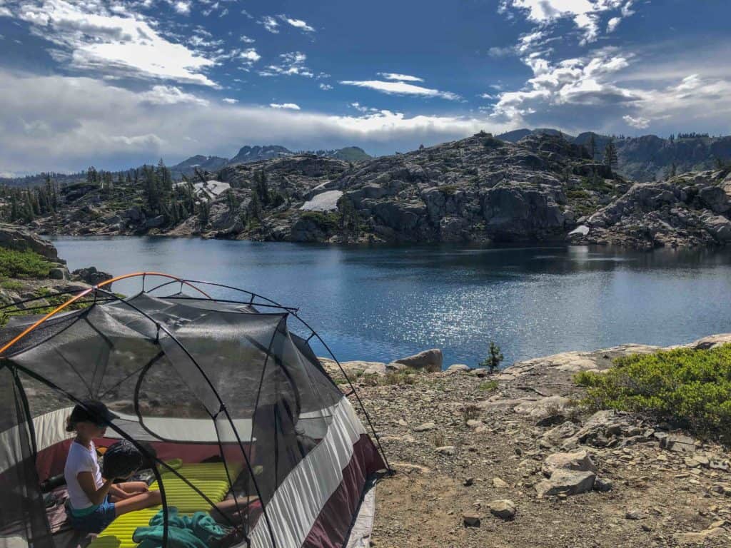 tent setup on a lakefront