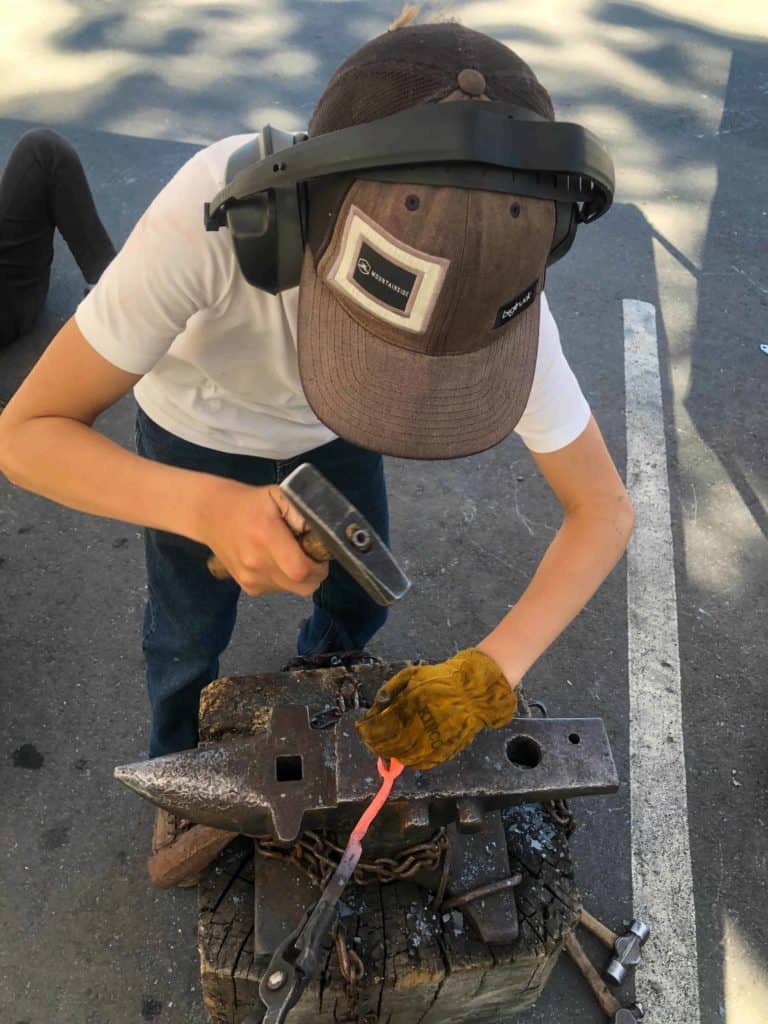 student using an anvil