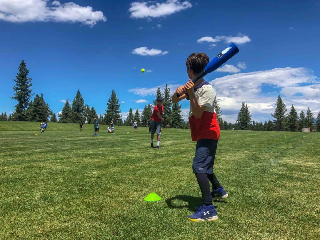 boy about to swing at an incoming pitch