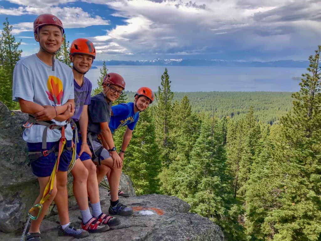 rock climbers standing on a cliff