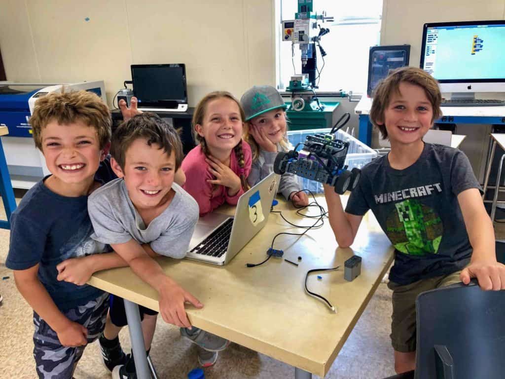 robotics students showing off their robot