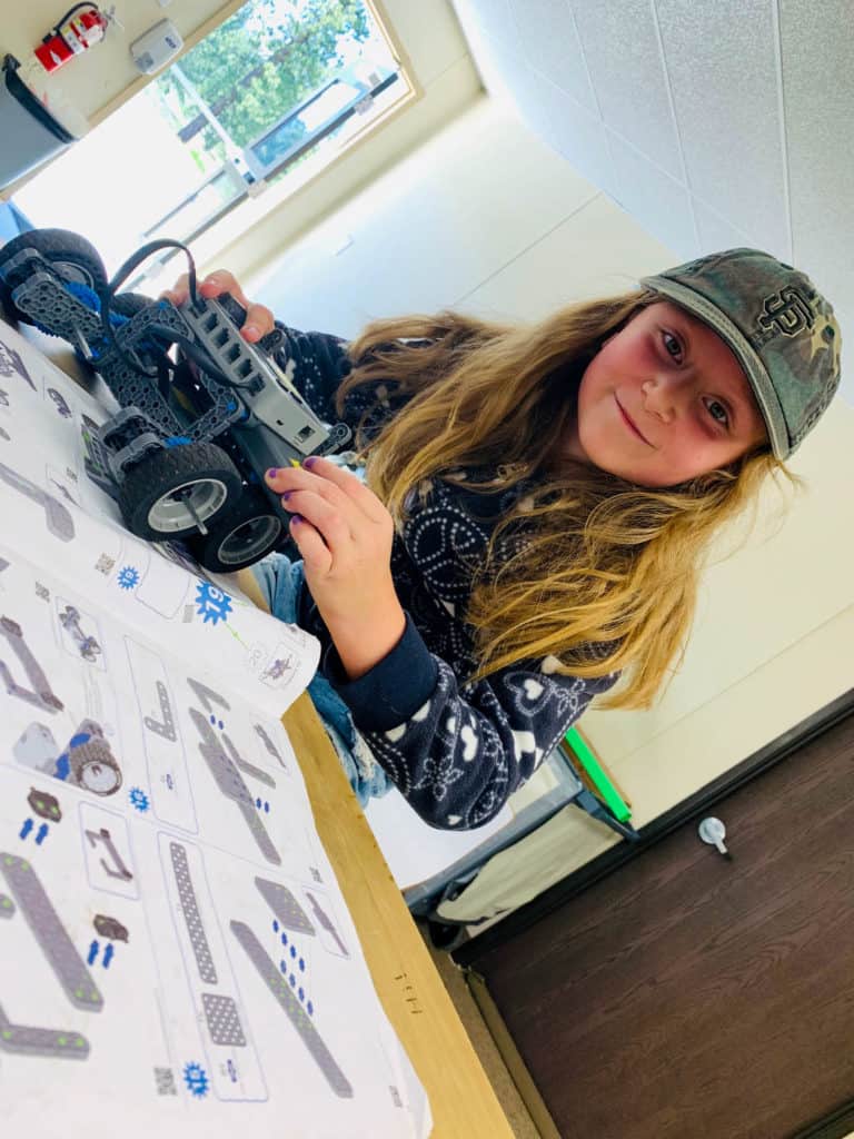 girl holding her robot