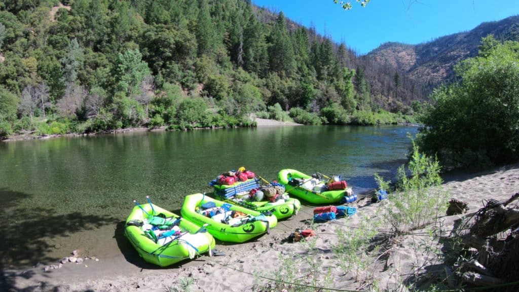 whitewater rafts docked by the lake